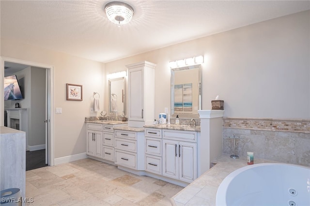 bathroom featuring vanity and a bathtub