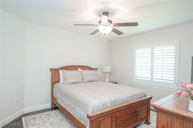 bedroom featuring ceiling fan and light hardwood / wood-style flooring