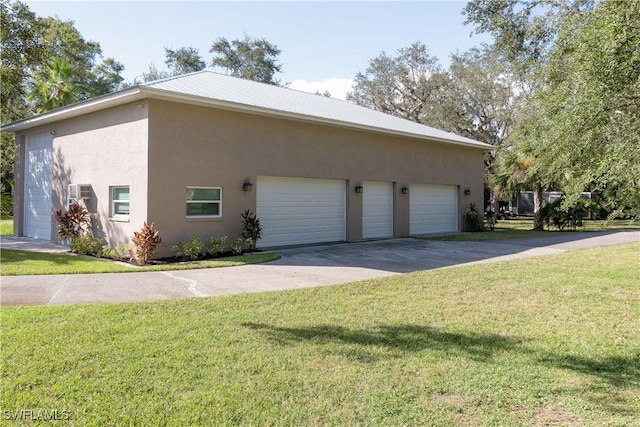 view of side of home featuring a yard and a garage