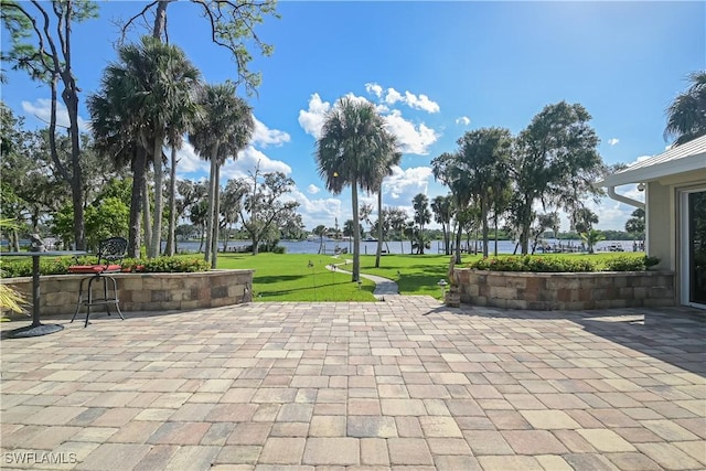 view of property's community featuring a patio area and a yard