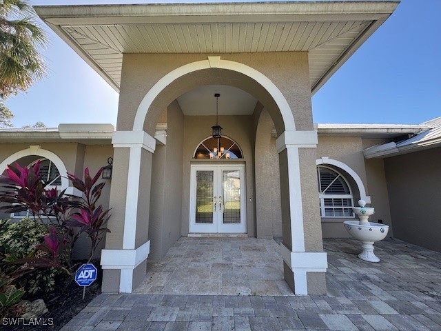 entrance to property featuring french doors