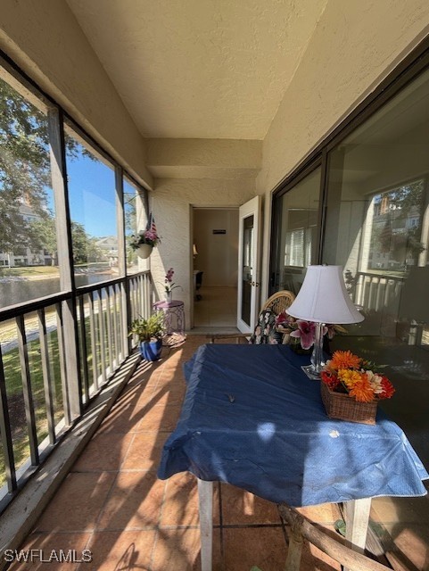 900 Arbor Lake Dr Unit 202, Naples, FL 34110 - view of patio featuring a balcony