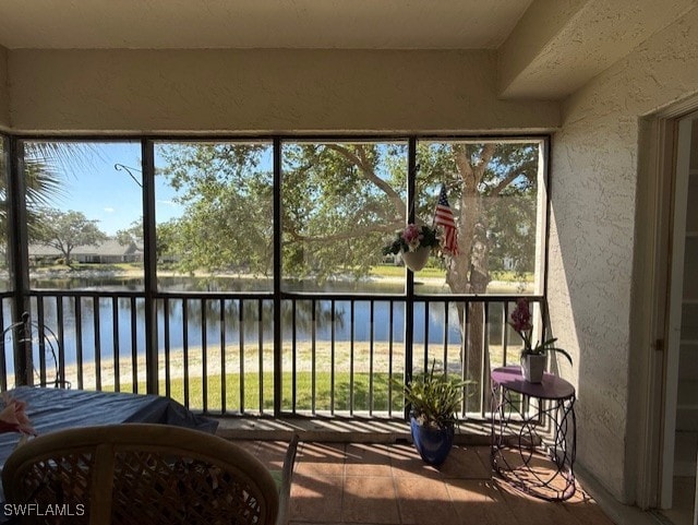 900 Arbor Lake Dr Unit 202, Naples, FL 34110 - sunroom with a water view