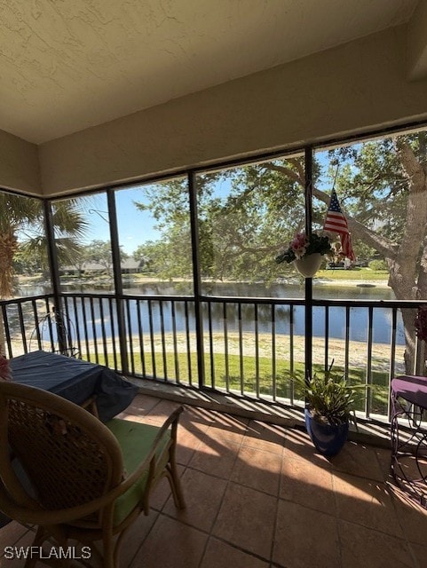 900 Arbor Lake Dr Unit 202, Naples, FL 34110 - sunroom / solarium with a water view