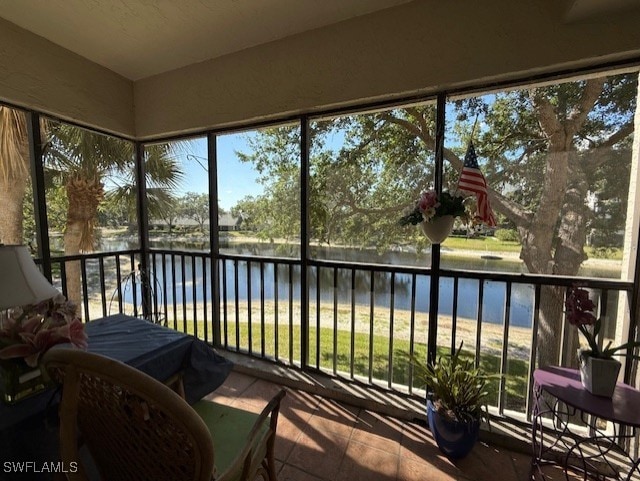 900 Arbor Lake Dr Unit 202, Naples, FL 34110 - sunroom featuring a water view