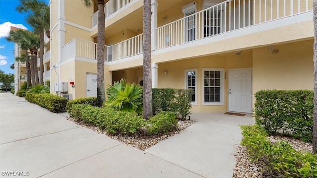 view of property featuring an AC wall unit