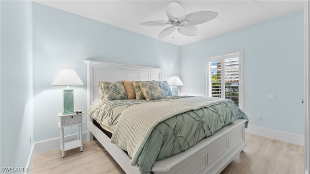 bedroom featuring ceiling fan and light hardwood / wood-style flooring