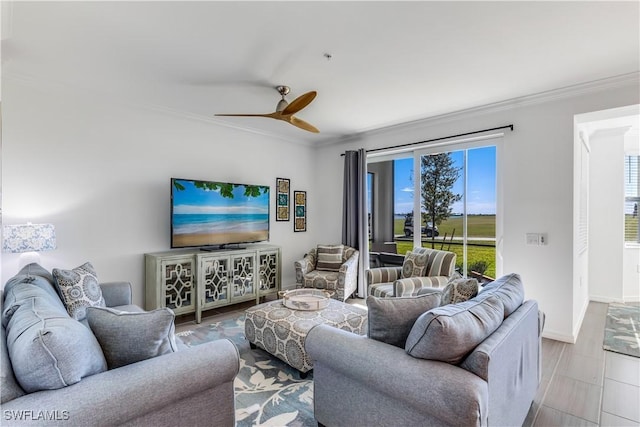 living room with ceiling fan and crown molding