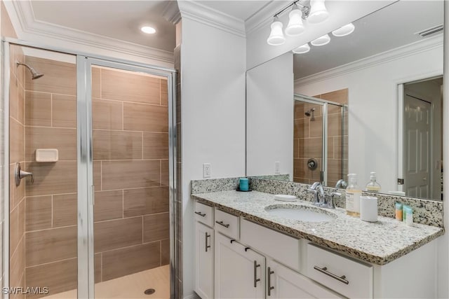 bathroom featuring vanity, walk in shower, and crown molding