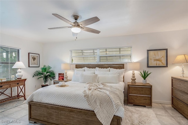 tiled bedroom with ceiling fan