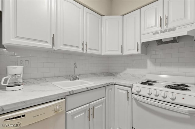 kitchen with white cabinets, white appliances, sink, and tasteful backsplash