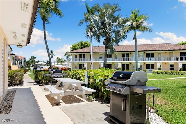 167 N Collier Blvd Unit D5, Marco Island, FL 34145 - view of patio / terrace featuring a grill and a residential view