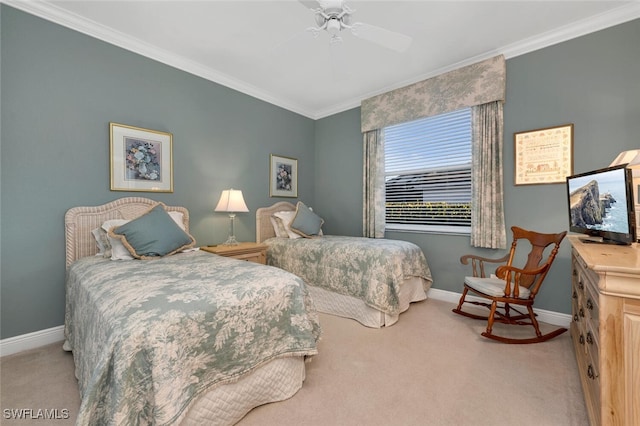 carpeted bedroom featuring ceiling fan and ornamental molding