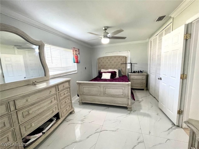 bedroom with ceiling fan and ornamental molding