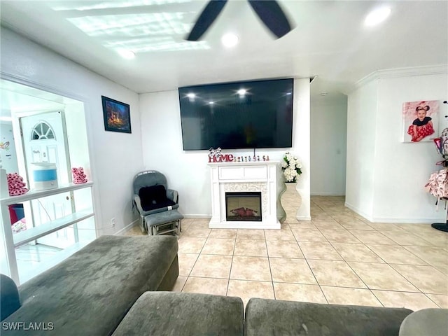 tiled living room featuring ceiling fan