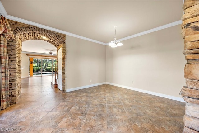 spare room with ceiling fan with notable chandelier and crown molding