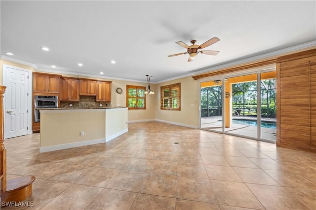 kitchen with decorative backsplash, ornamental molding, double oven, ceiling fan, and light tile patterned flooring