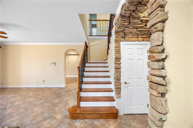 stairs featuring ornamental molding