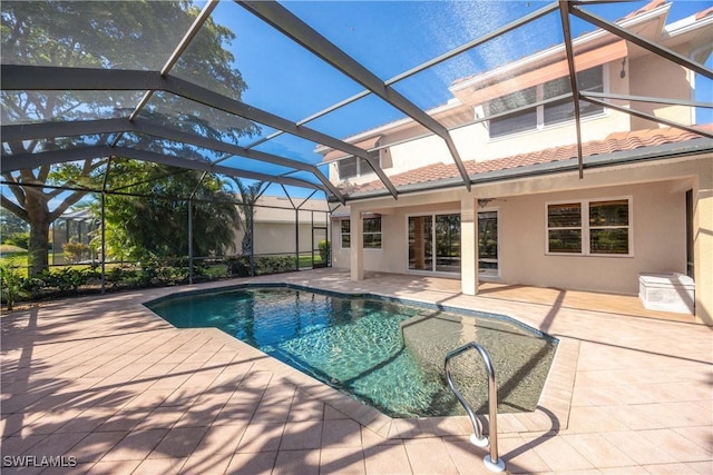 view of swimming pool featuring a lanai and a patio area