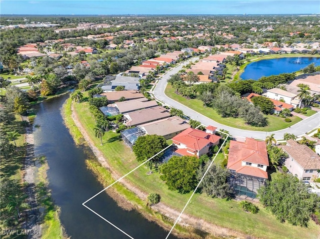 birds eye view of property featuring a water view