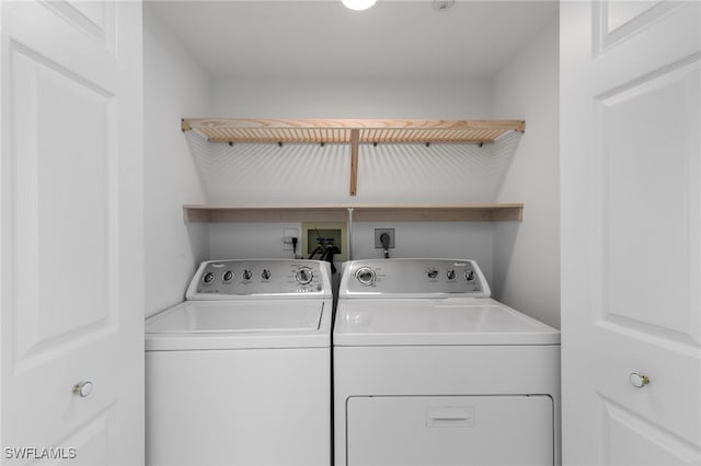 laundry room with independent washer and dryer