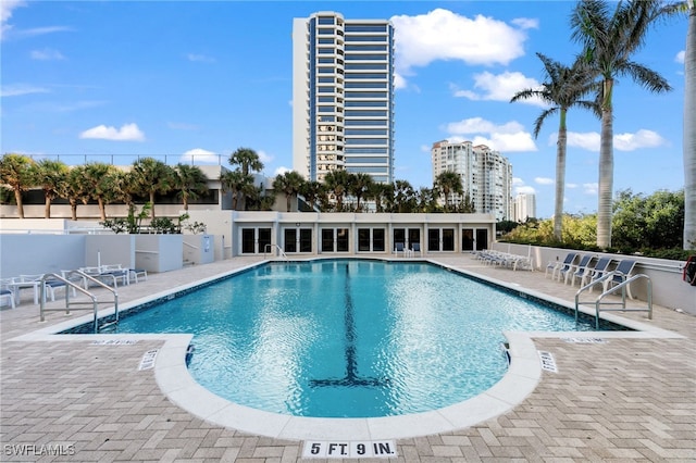 view of swimming pool featuring a patio area