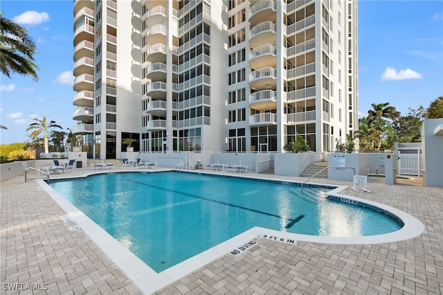 view of swimming pool with a patio