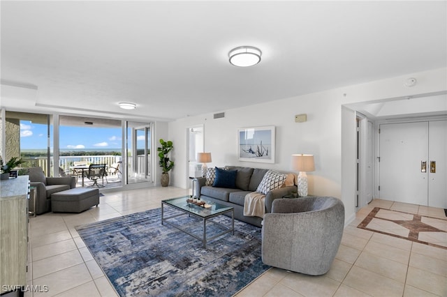 tiled living room with expansive windows