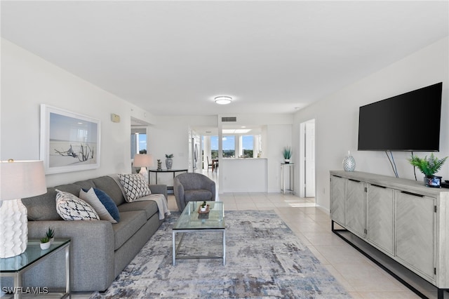 living room with light tile patterned flooring