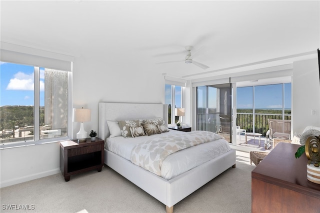 carpeted bedroom with access to outside and ceiling fan