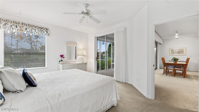 bedroom featuring access to exterior, ceiling fan with notable chandelier, and light colored carpet