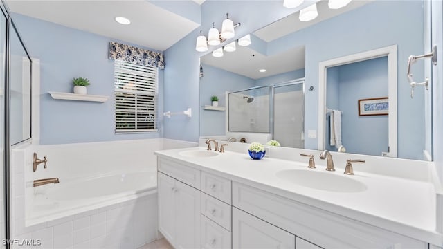 bathroom with vanity and separate shower and tub