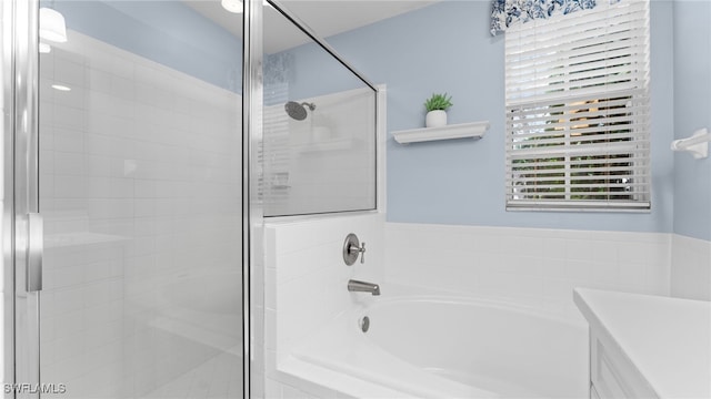 bathroom with shower with separate bathtub