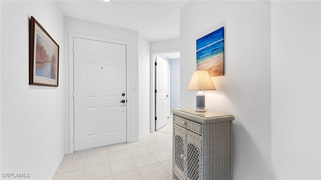 entryway featuring light tile patterned flooring