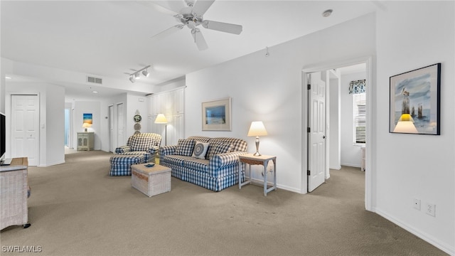 living room with light carpet and ceiling fan