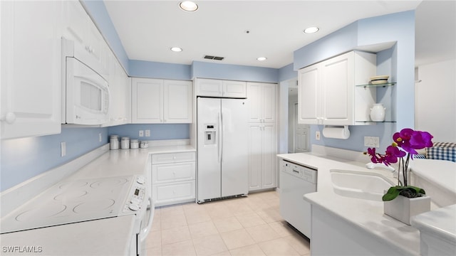 kitchen featuring white cabinetry, white appliances, and sink