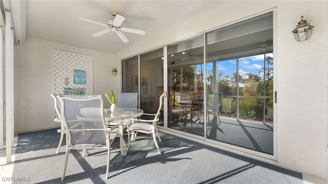 sunroom / solarium featuring a wealth of natural light and ceiling fan