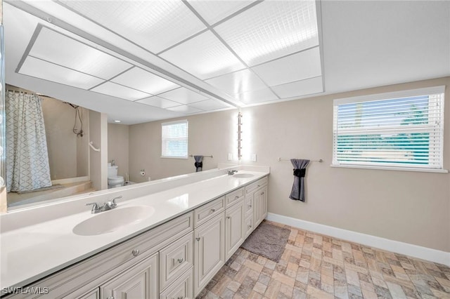 bathroom with a shower with curtain, vanity, and toilet