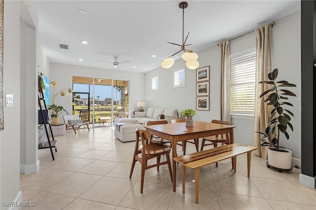 dining area featuring ceiling fan and light tile patterned flooring