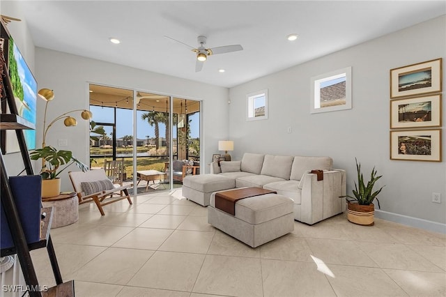 living room with ceiling fan and light tile patterned floors