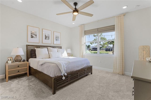 bedroom featuring ceiling fan and light colored carpet