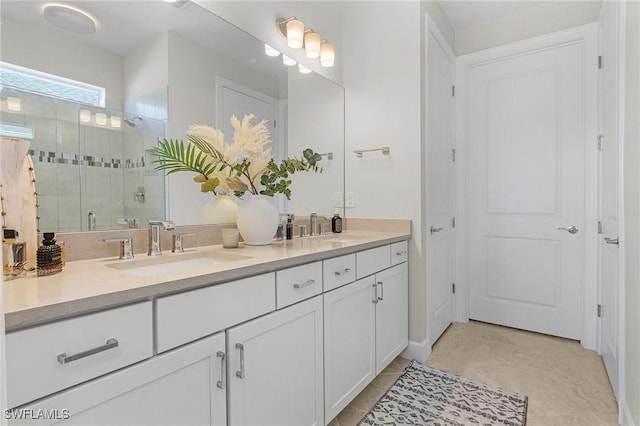 bathroom featuring tile patterned flooring, vanity, and walk in shower