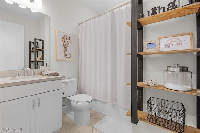 full bathroom featuring toilet, tile patterned floors, vanity, and shower / tub combo with curtain