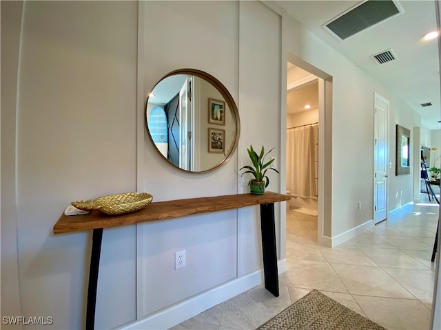 hallway featuring light tile patterned flooring