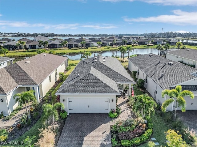 birds eye view of property featuring a water view