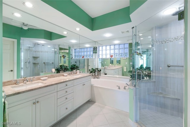 bathroom featuring tile patterned floors, vanity, and separate shower and tub