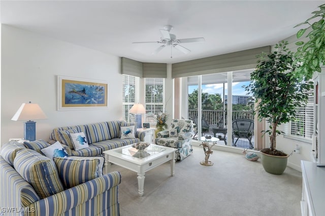 living room featuring carpet and ceiling fan