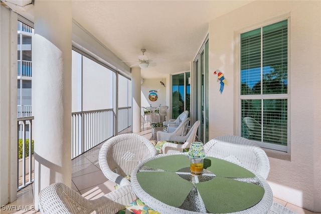 sunroom with a wealth of natural light and ceiling fan