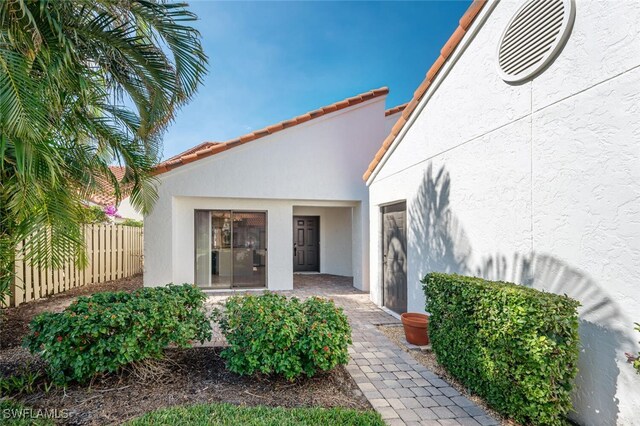 907 Reef Point Cir, Naples, FL 34108 - entrance to property with stucco siding
