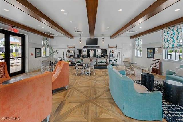 living room with beam ceiling, french doors, light parquet floors, and a wealth of natural light